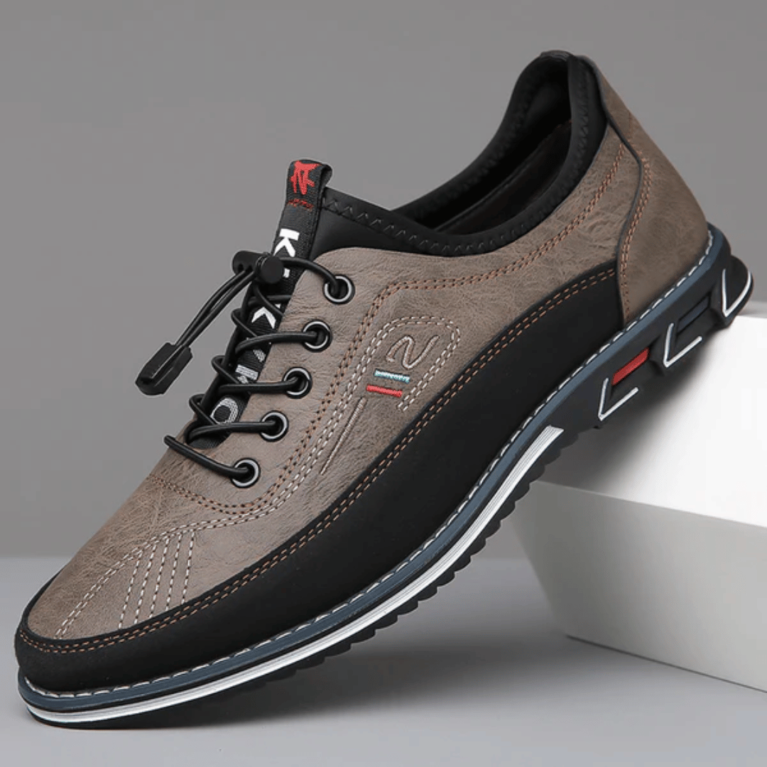 A pair of Oxford Comfort Sneakers featuring a brown upper with black accents and a white sole.