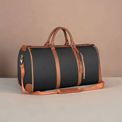 A white and brown Elegance Travel Duffel bag placed against a pink background.