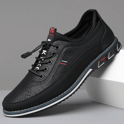 A pair of Oxford Comfort Sneakers featuring a brown upper with black accents and a white sole.