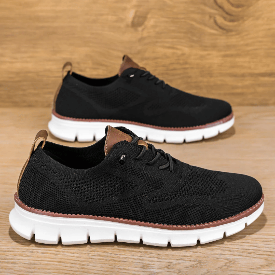 A pair of black Hugo Ultra Comforatable Shoes with a lace-up closure, featuring a breathable knit upper, a removable honeycomb foam footbed, and a high-density TPU sole.