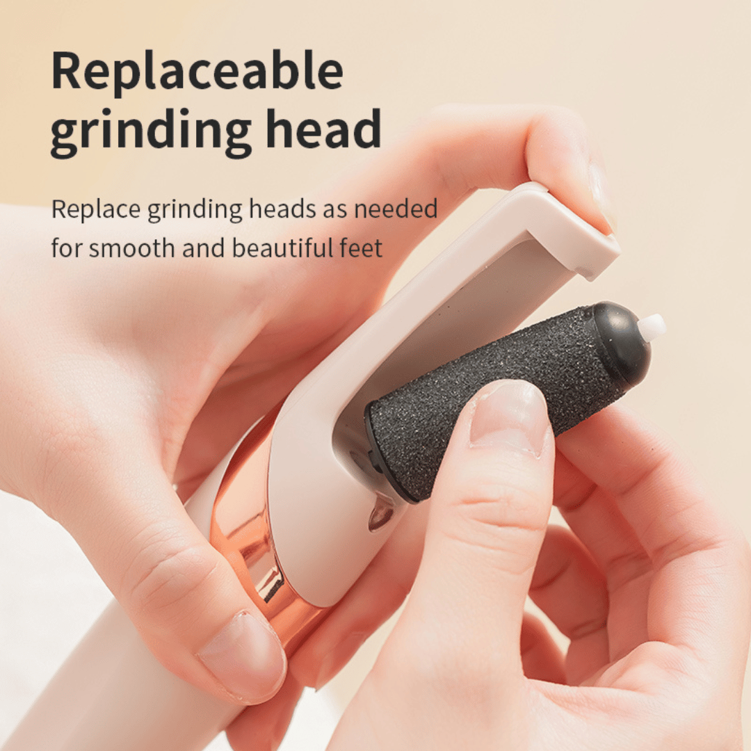 Foot care device with replaceable grinding head held by a hand on a beige background