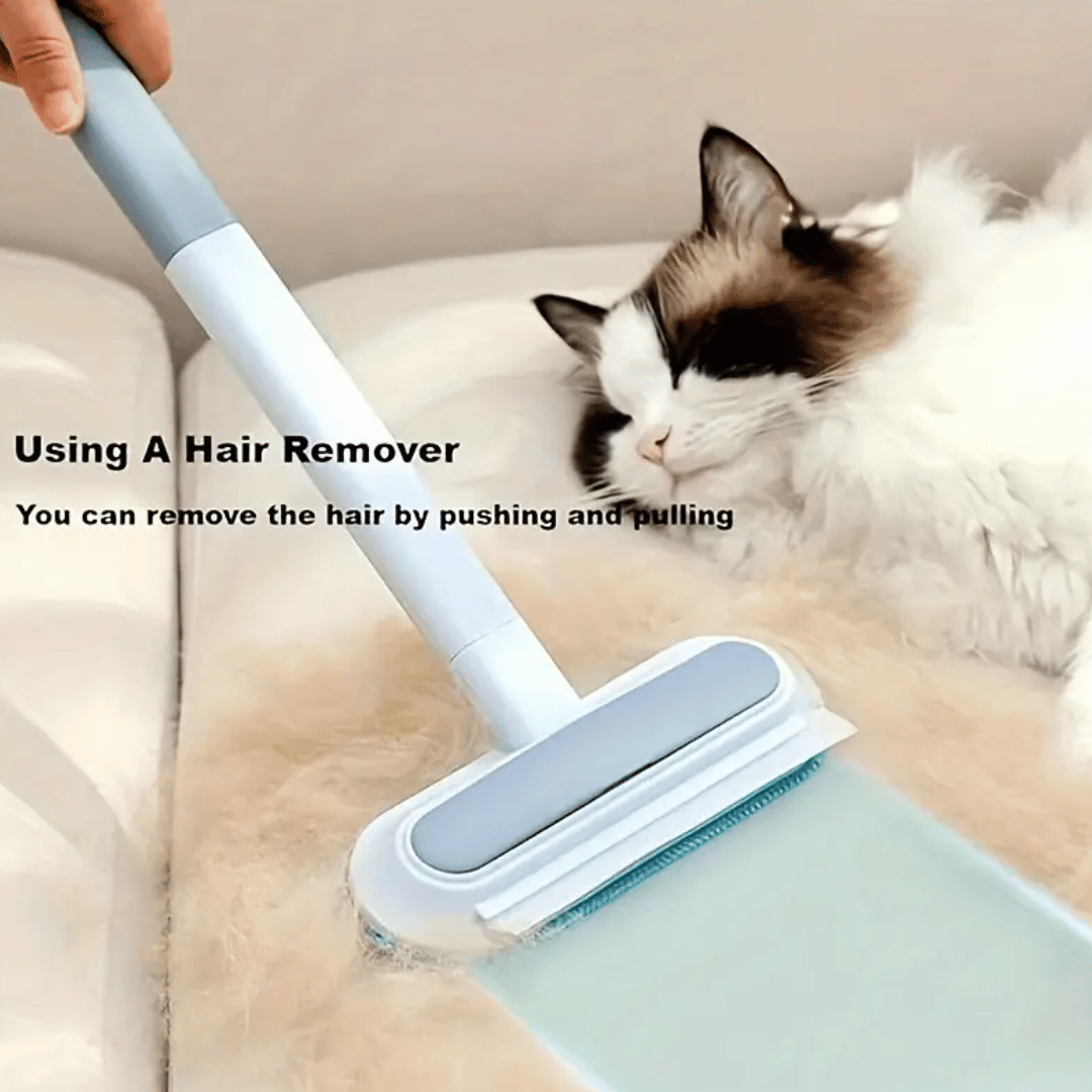 Hair remover being used on a couch with a cat sitting nearby