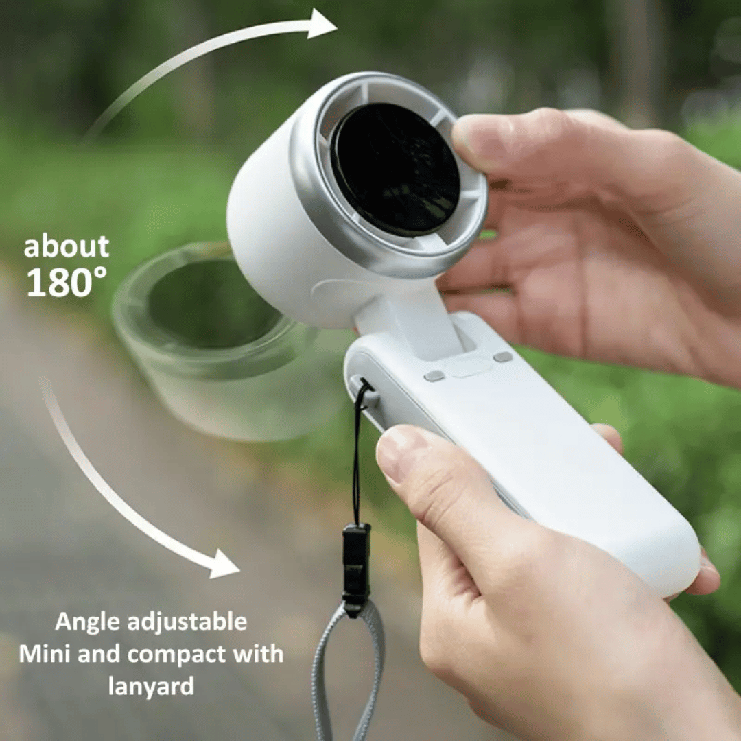 Handheld device with adjustable angle and lanyard, held by a person outdoors.