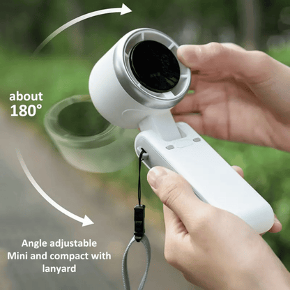 Handheld device with adjustable angle and lanyard, held by a person outdoors.