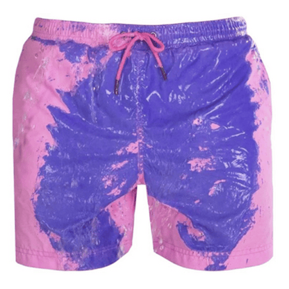 A collection of SplashShift Shorts in various colors, featuring a man modeling the yellow pair, with other pairs shown in blue, orange, and green splattered patterns.