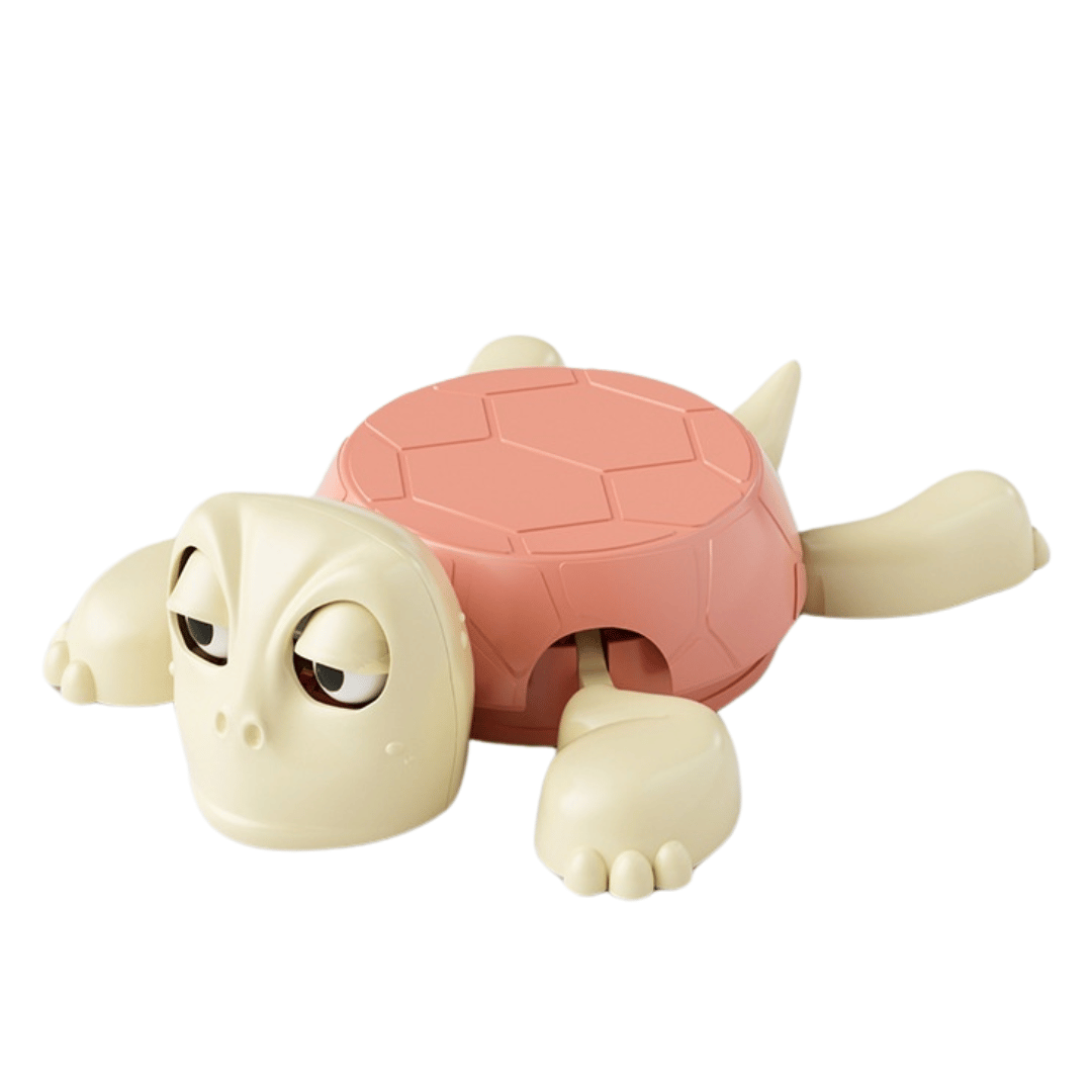 A child playing with a toy turtle that has a movable head and appears to be making a humorous expression.