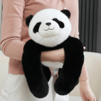 Person holding a plush panda toy