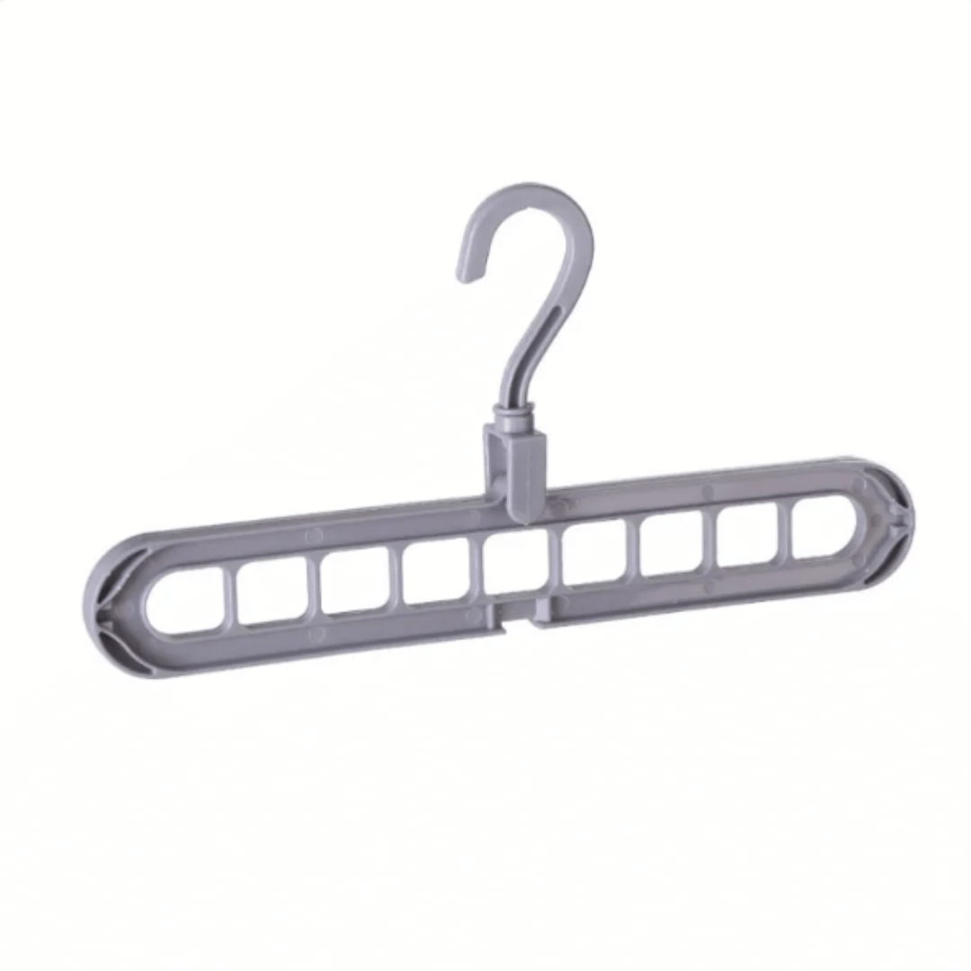 A set of multi-functional space-saving hangers arranged in a wardrobe, holding various garments.