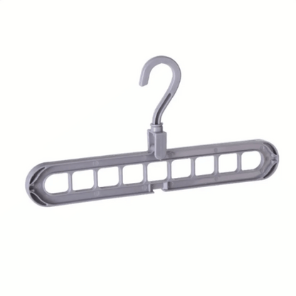 A set of multi-functional space-saving hangers arranged in a wardrobe, holding various garments.
