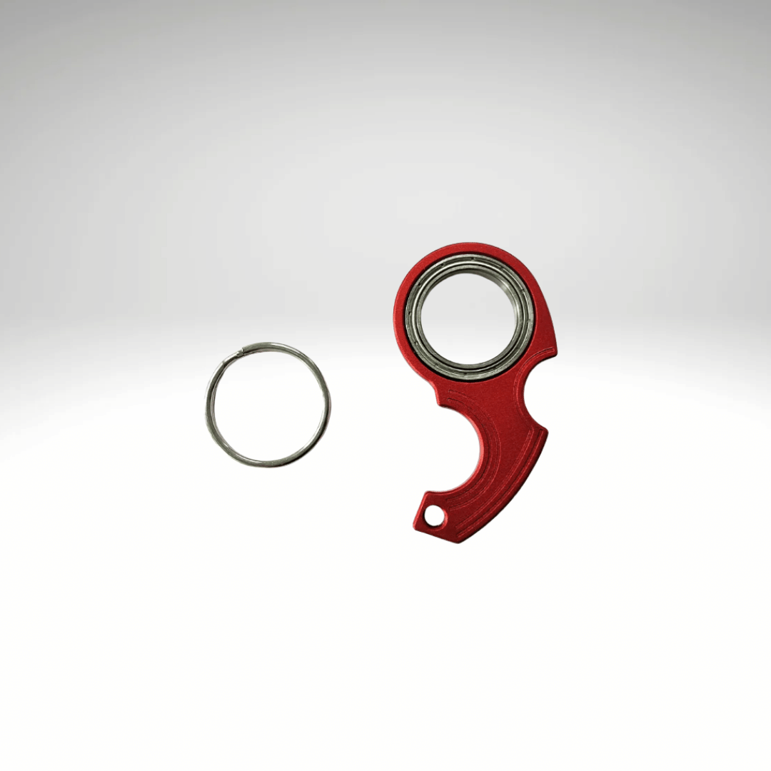 A keychain fidget spinner accessory disassembled into two pieces, a black main component and a metallic ring, displayed against a white background.