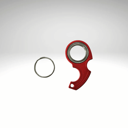 A keychain fidget spinner accessory disassembled into two pieces, a black main component and a metallic ring, displayed against a white background.