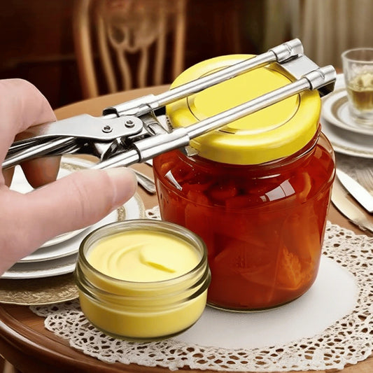Person using a jar opener on a jar of honey with a small container of honey nearby.