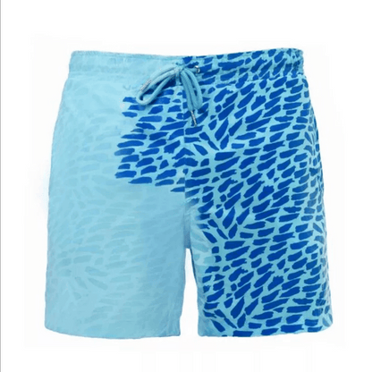 A collection of SplashShift Shorts in various colors, featuring a man modeling the yellow pair, with other pairs shown in blue, orange, and green splattered patterns.
