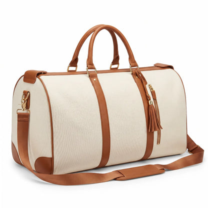 Beige duffel bag with brown leather straps and accents on a white background