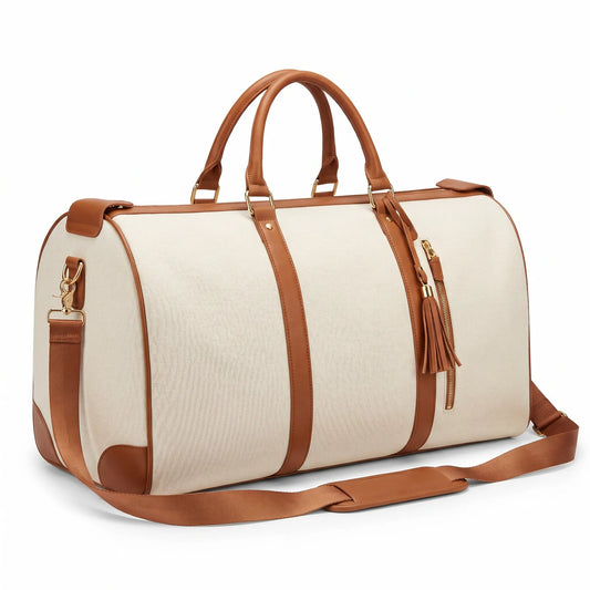 Beige duffel bag with brown leather straps and accents on a white background